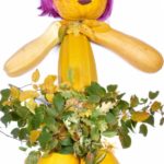 Doll made of pumpkins periwig and leaves