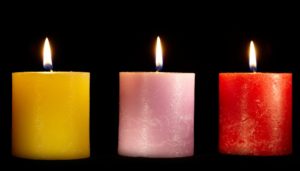 Three candles set the mood for psychic predictions for 2024